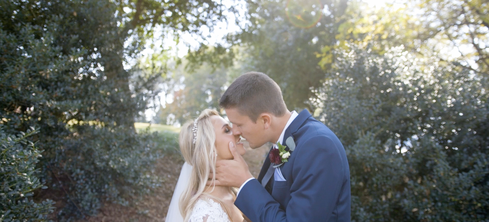 bride and groom kiss during their first look