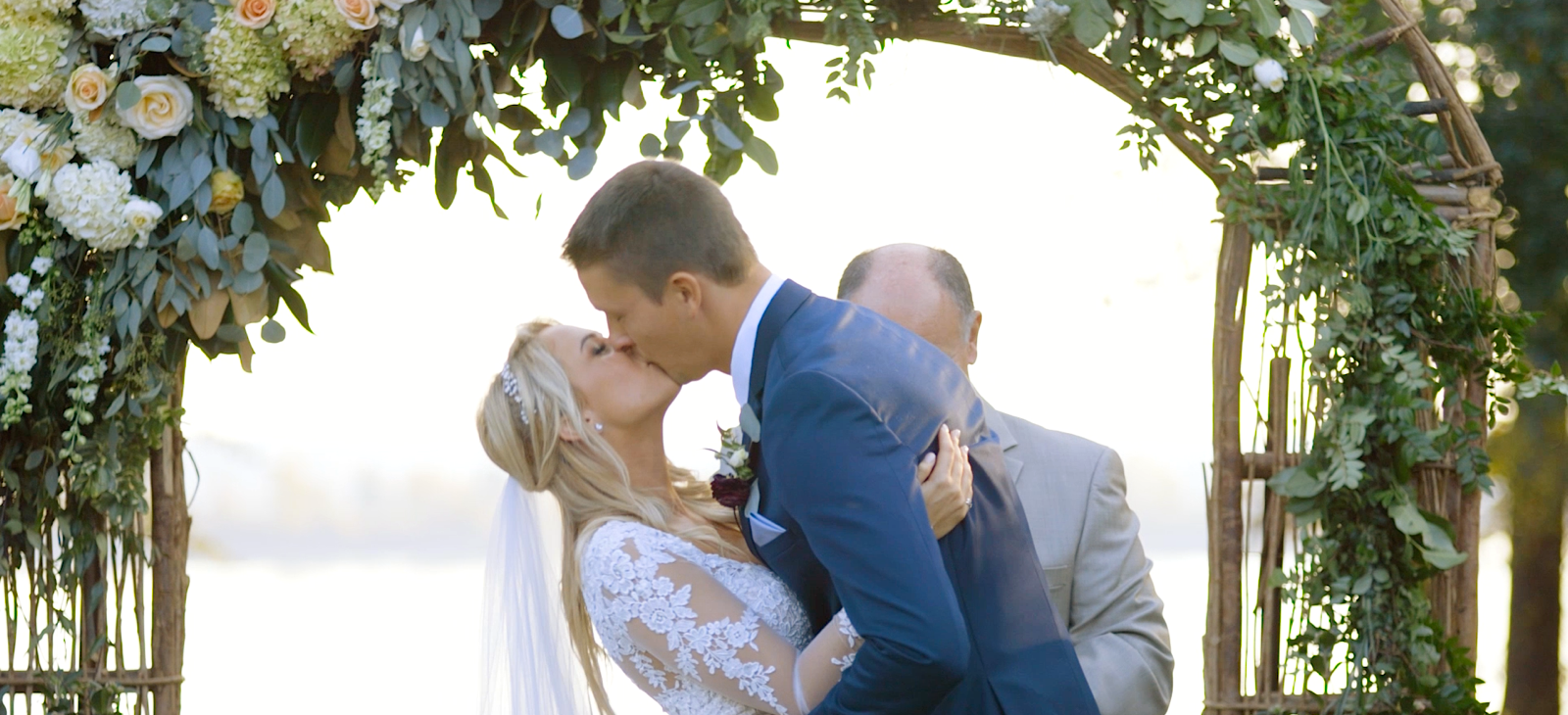 bride and groom first kiss during ceremony at clemson sc